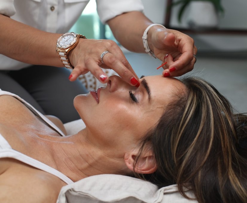 Provider performing a microneedling scalp treatment
